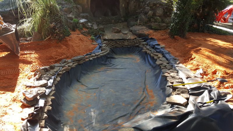 A pond that is being constructed in the ground.