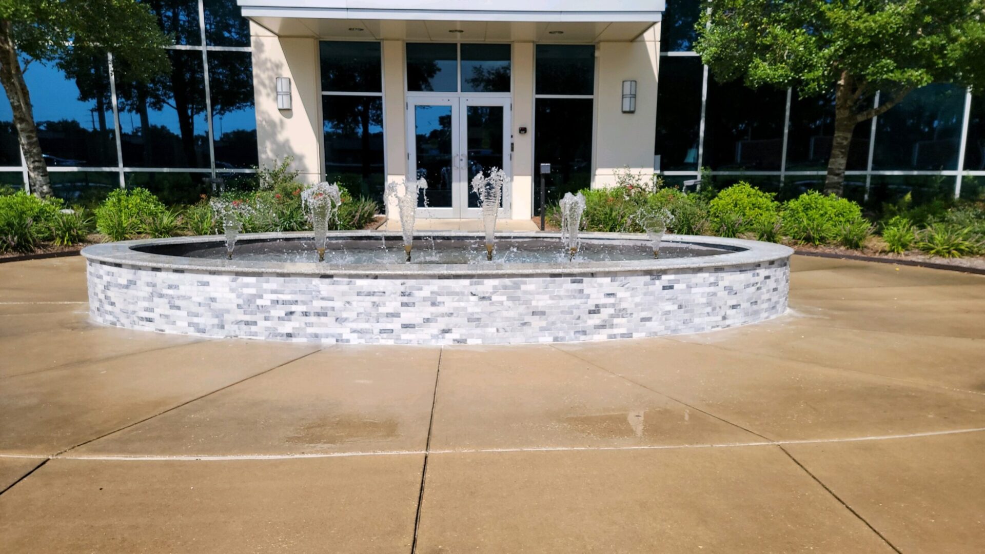 A building with a fountain in front of it