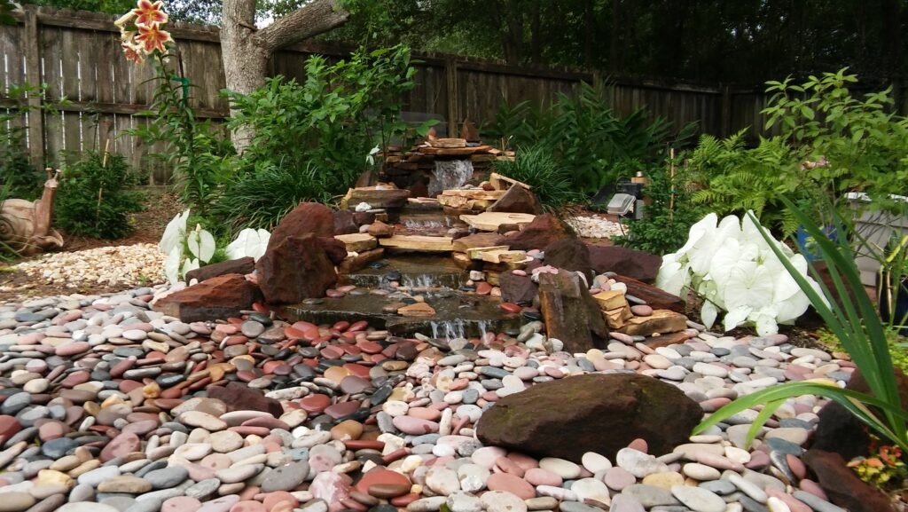 A garden with rocks and water features