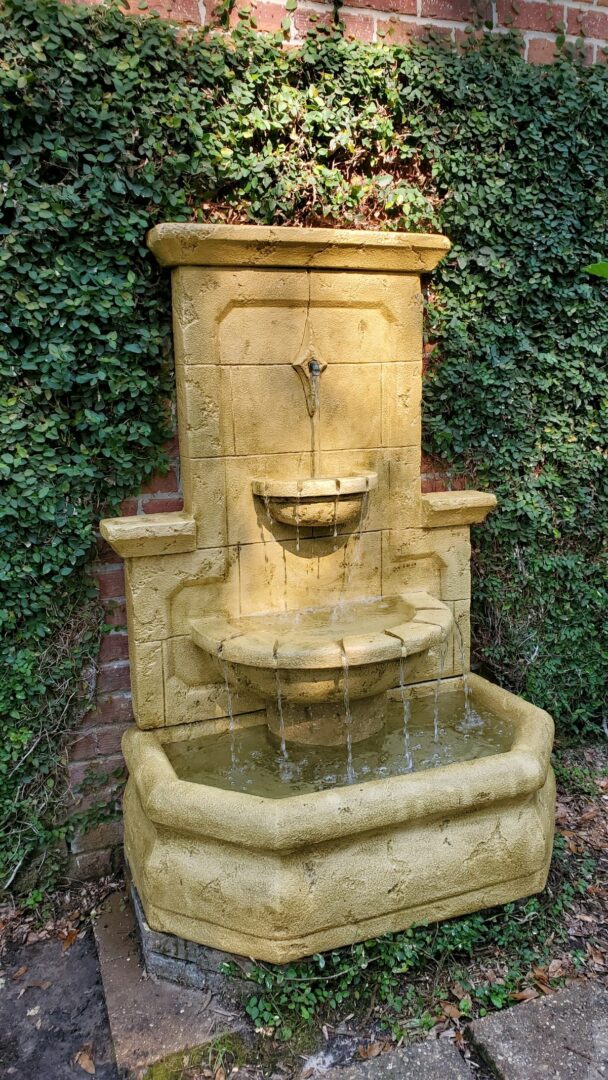 A fountain with water pouring out of it.
